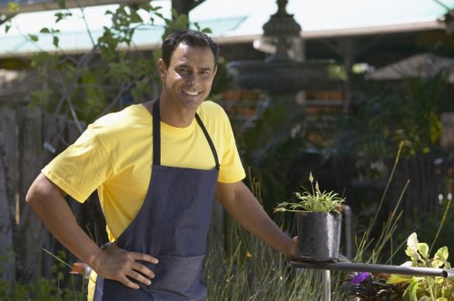 Gardener wearing protective equipment during outdoor maintenance